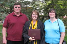 Dad, Me, and Mom in 2008 at my college graduation.